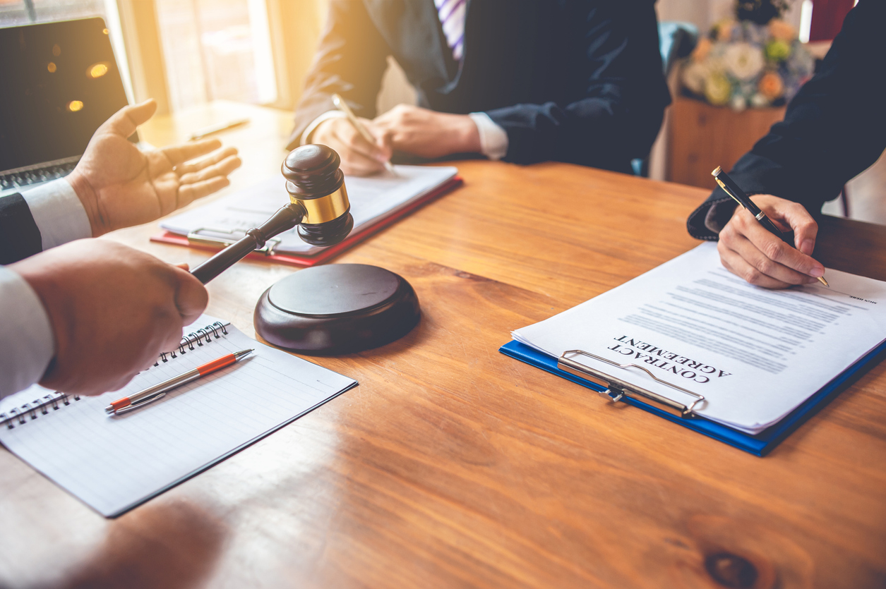 business people and lawyers discussing contract papers.Legal planning. Concepts of law, advice, legal services