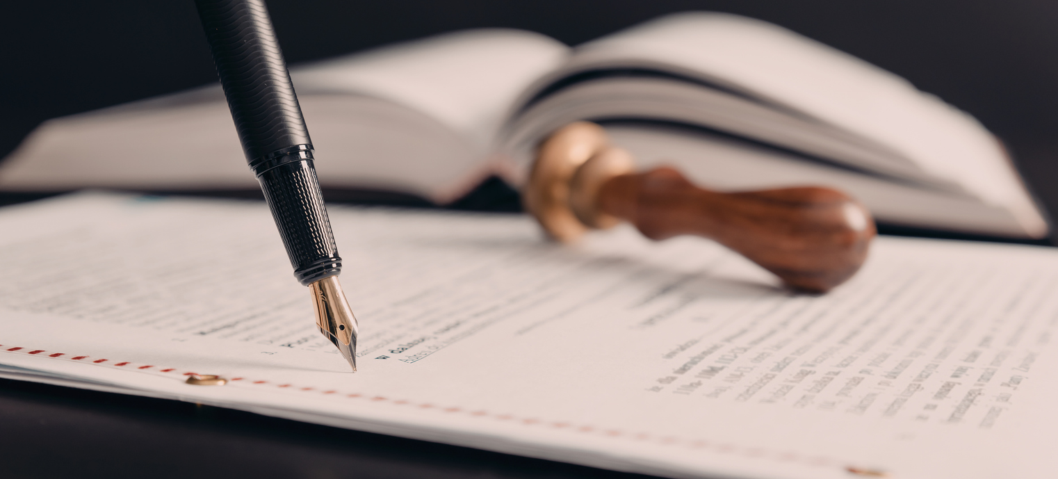 Agreement concept with fountain pen and documents. Notary public, attorney, law close up composition