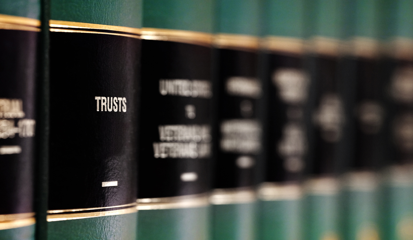Legal law books on shelf with labels for learing understanding judicial case Trusts and Estate Planning
