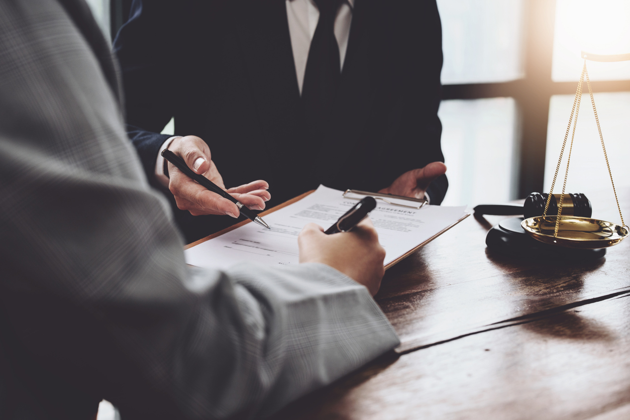 Discussing legal matters and signing important documents.
