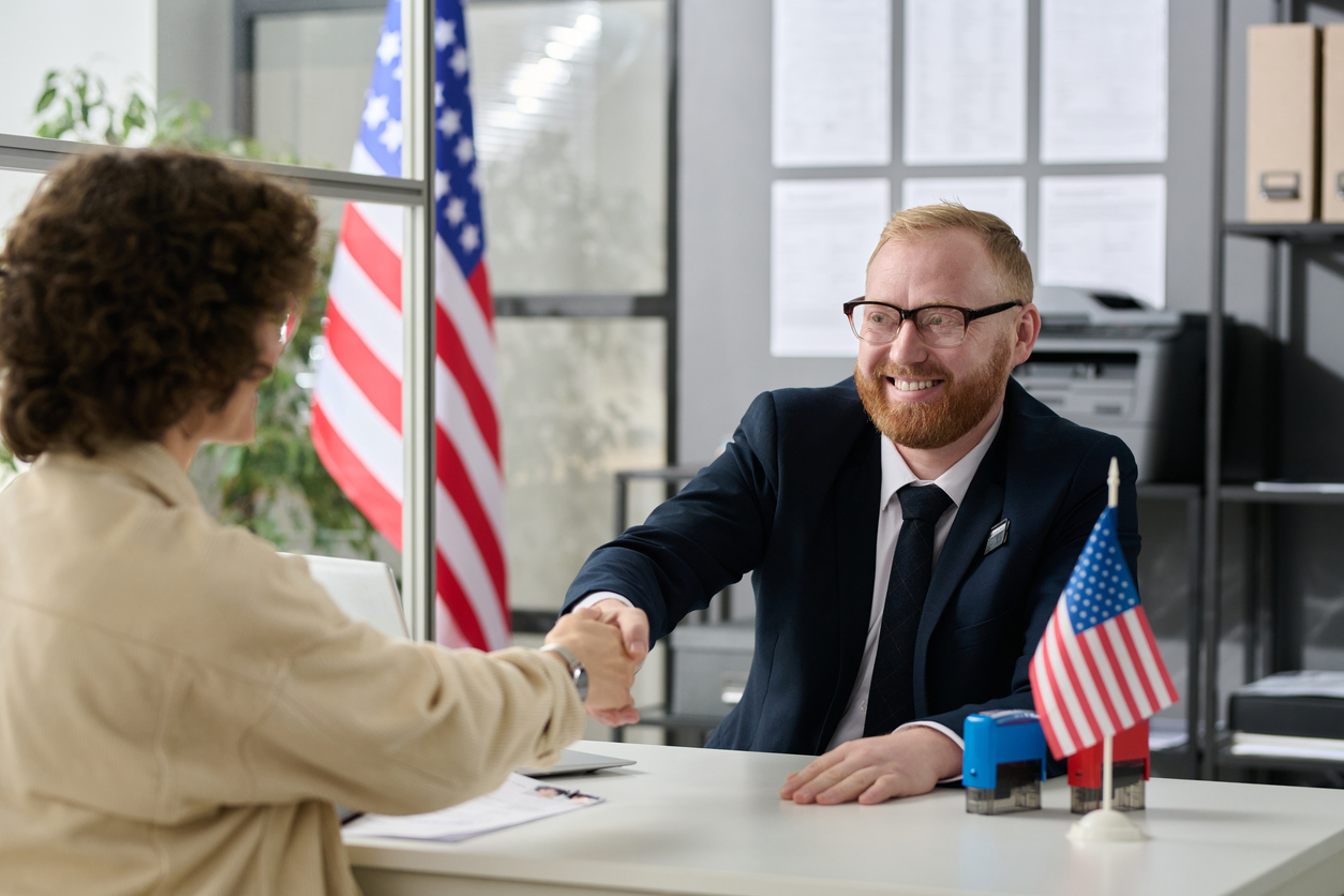 Consultant shaking hands with client
