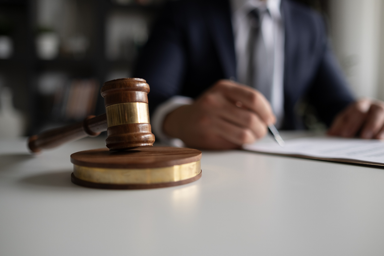 lawyer examining and signing legal documents.