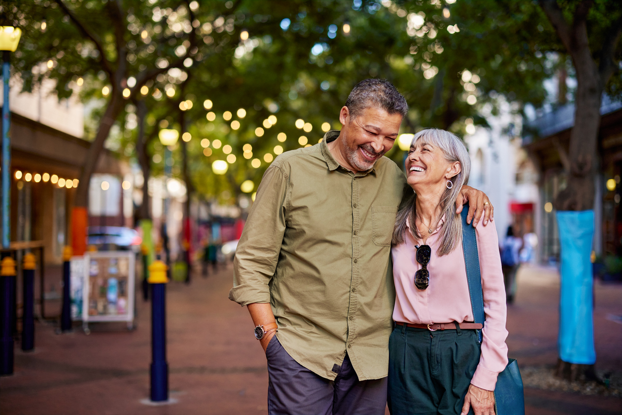 Happy mature couple laughing outdoors