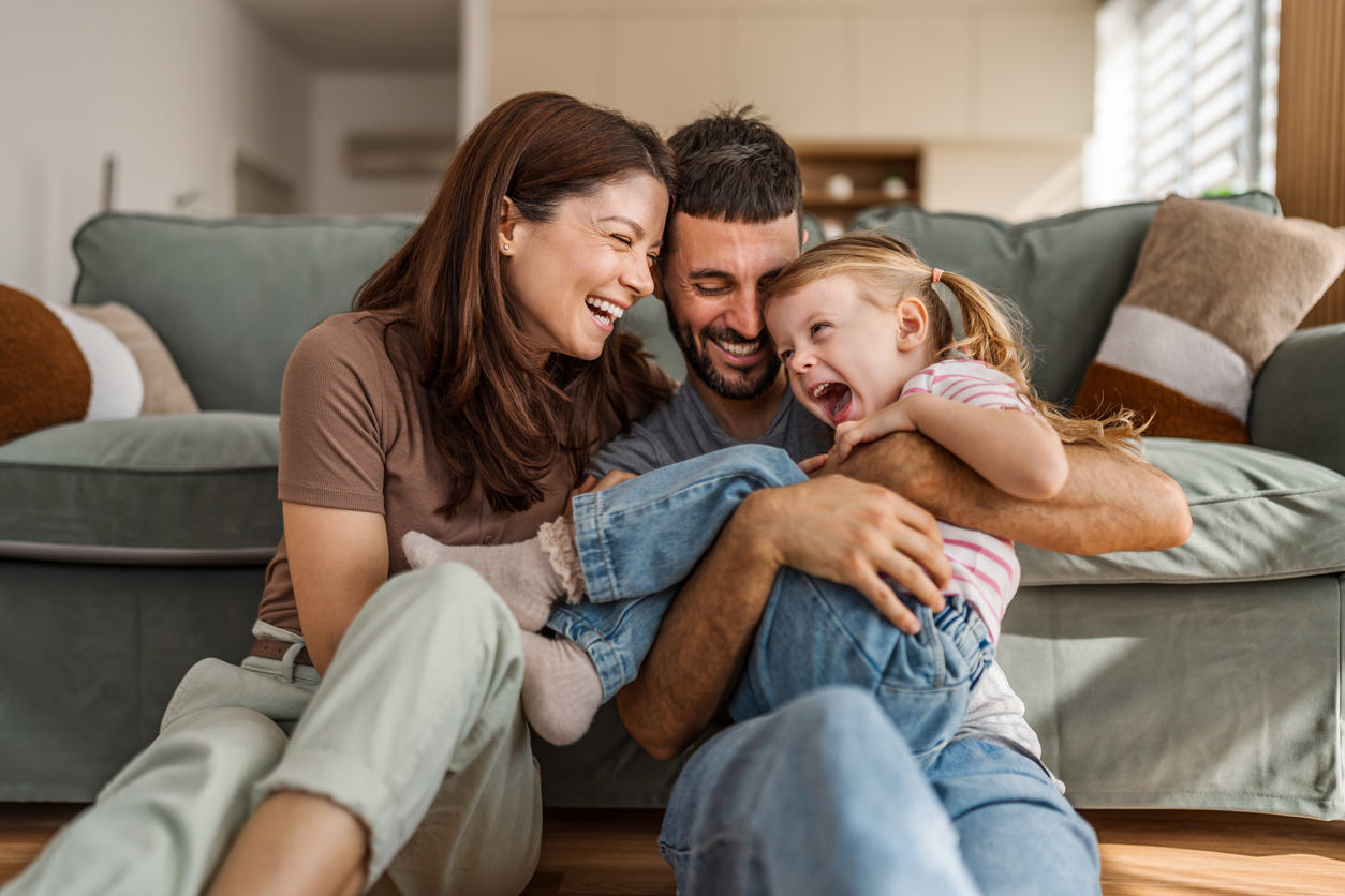 Happy family bonding and laughing together at home