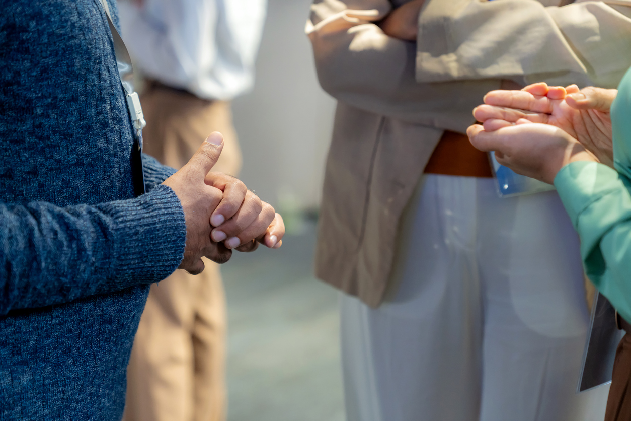 Close Up Professionals Clasping Hands in Business Discussi