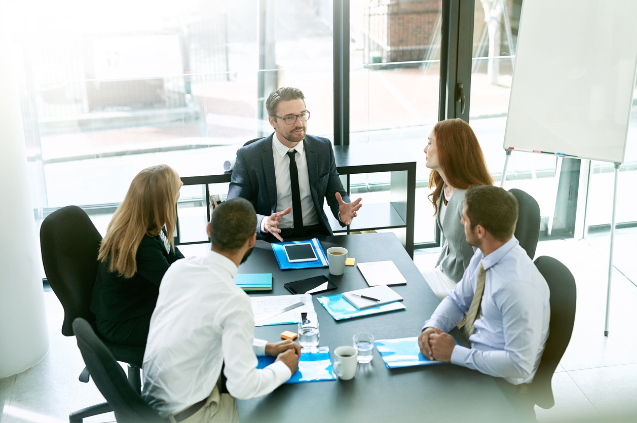 Shot of a team of executives having a formal meeting in a boardroom