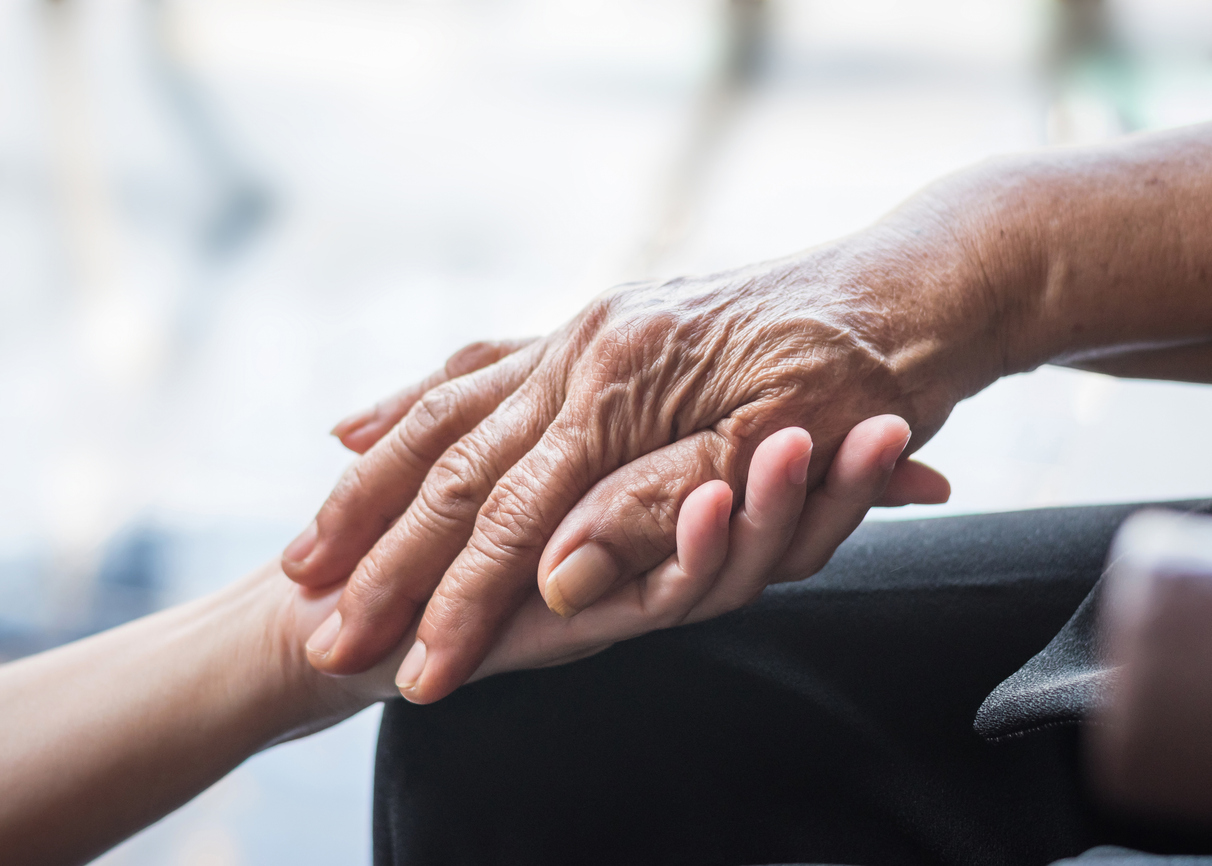Elderly senior person in support of nursing family caregiver